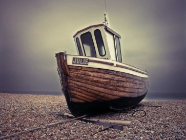 Assaf Frank - Boat moored on pebbled Beach