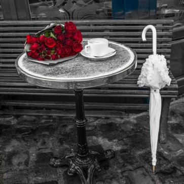 Assaf Frank - Bunch of flowers on sidewalk cafe table, Paris, France
