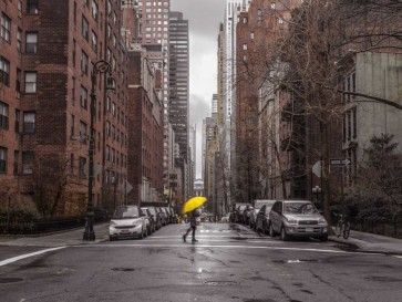 Assaf Frank - Tourist with yellow umbrella on street of Manhattan, New York