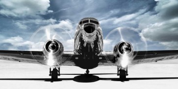 Gasoline Images - Airplane taking off in a blue sky