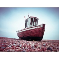 Assaf Frank - Boat moored on pebbled Beach