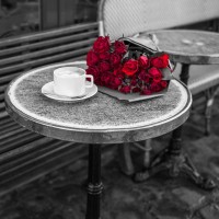 Assaf Frank - Bunch of flowers on sidewalk cafe table, Paris, France