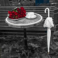 Assaf Frank - Bunch of flowers on sidewalk cafe table, Paris, France