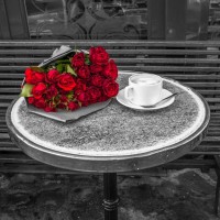 Assaf Frank - Bunch of flowers on sidewalk cafe table, Paris, France