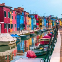 Assaf Frank - Multi-Coloured houses next to a canal, Burano, Italy