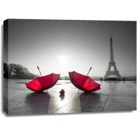 Assaf Frank - Two umbrellas next to the Eiffel tower