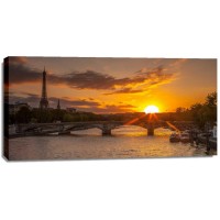 Assaf Frank - View of the Eiffel Tower with a bridge in the foreground during sunset, Paris, France