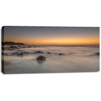 Assaf Frank - Sunset on rocky beach with colorful sky