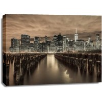 Assaf Frank - Manhattan skyline with rows of groynes in foreground, New York